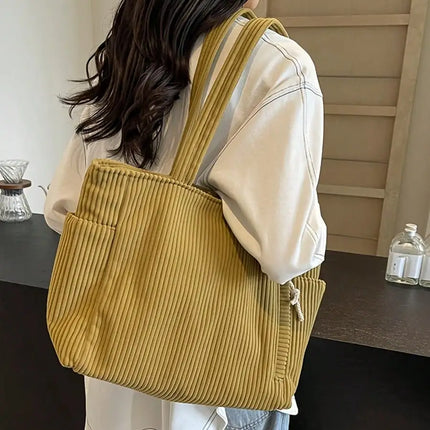 A stylish new tote bag for women—crafted from soft, comfortable corduroy fabric, making it the ideal choice for daily commuting.